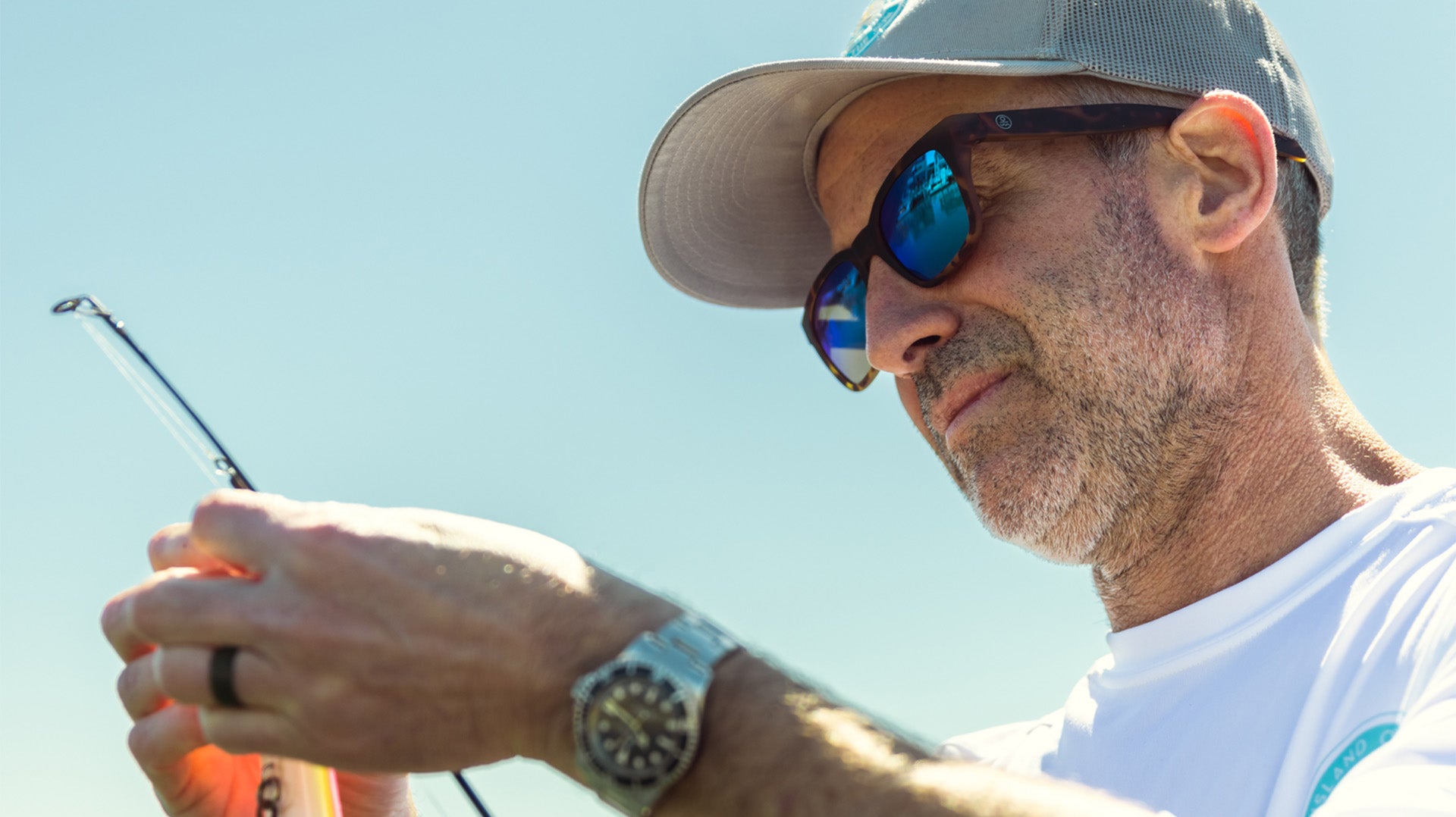 Person wearing prescription sunglasses looking comfortably at a bright outdoor scene, illustrating the effectiveness and value of prescription sunglasses in enhancing vision clarity and protection against sunlight.