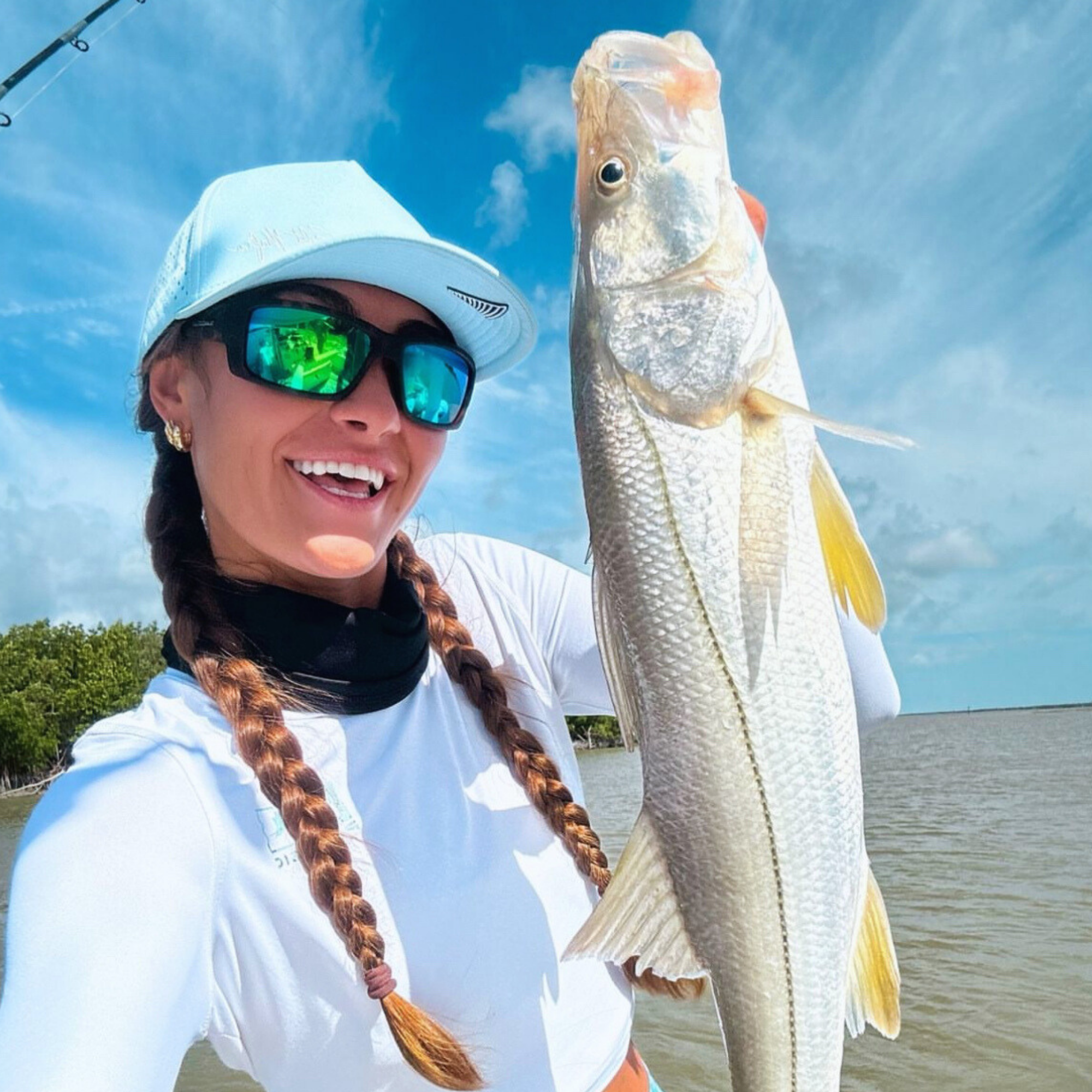 Stylish Island Optics sunglasses displayed against a tropical beach backdrop, showcasing their sleek design and suitability for sunny island environments.